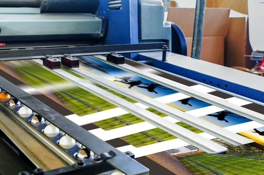 Close up of an offset printing machine during production Close up of an offset printing machine during production