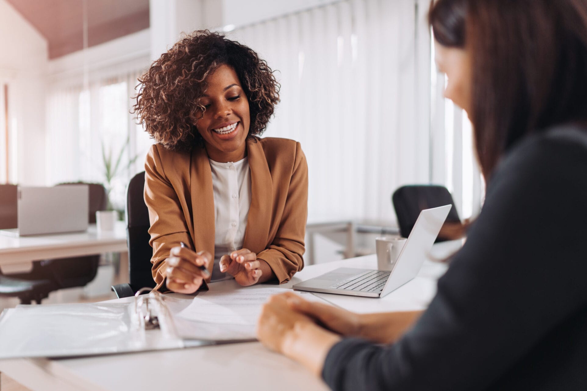 Client consulting with a agent Client consulting with a agent